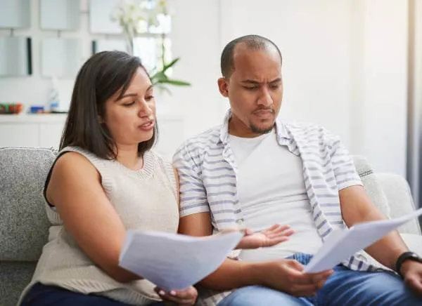 Couple looking at homebuying legal documents