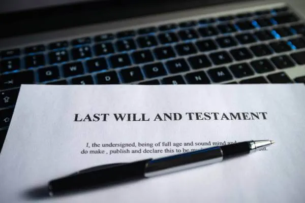 Last Will and Testament laying on a keyboard