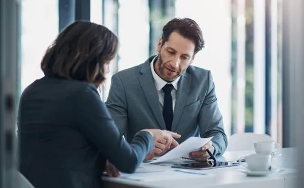 Lawyer discussing business formation options with businesswoman