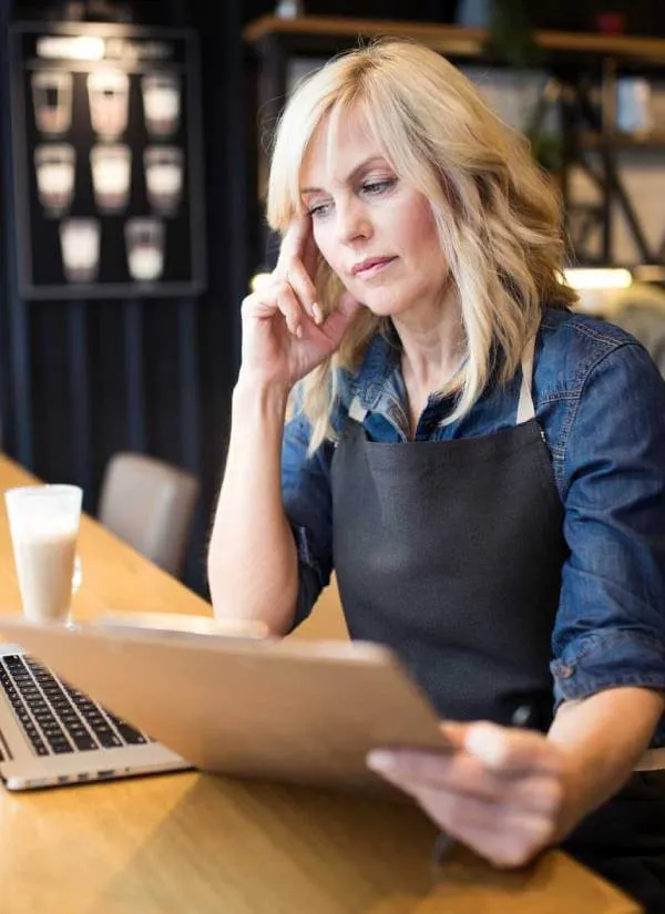 business owner contemplating llc and llp pros and cons