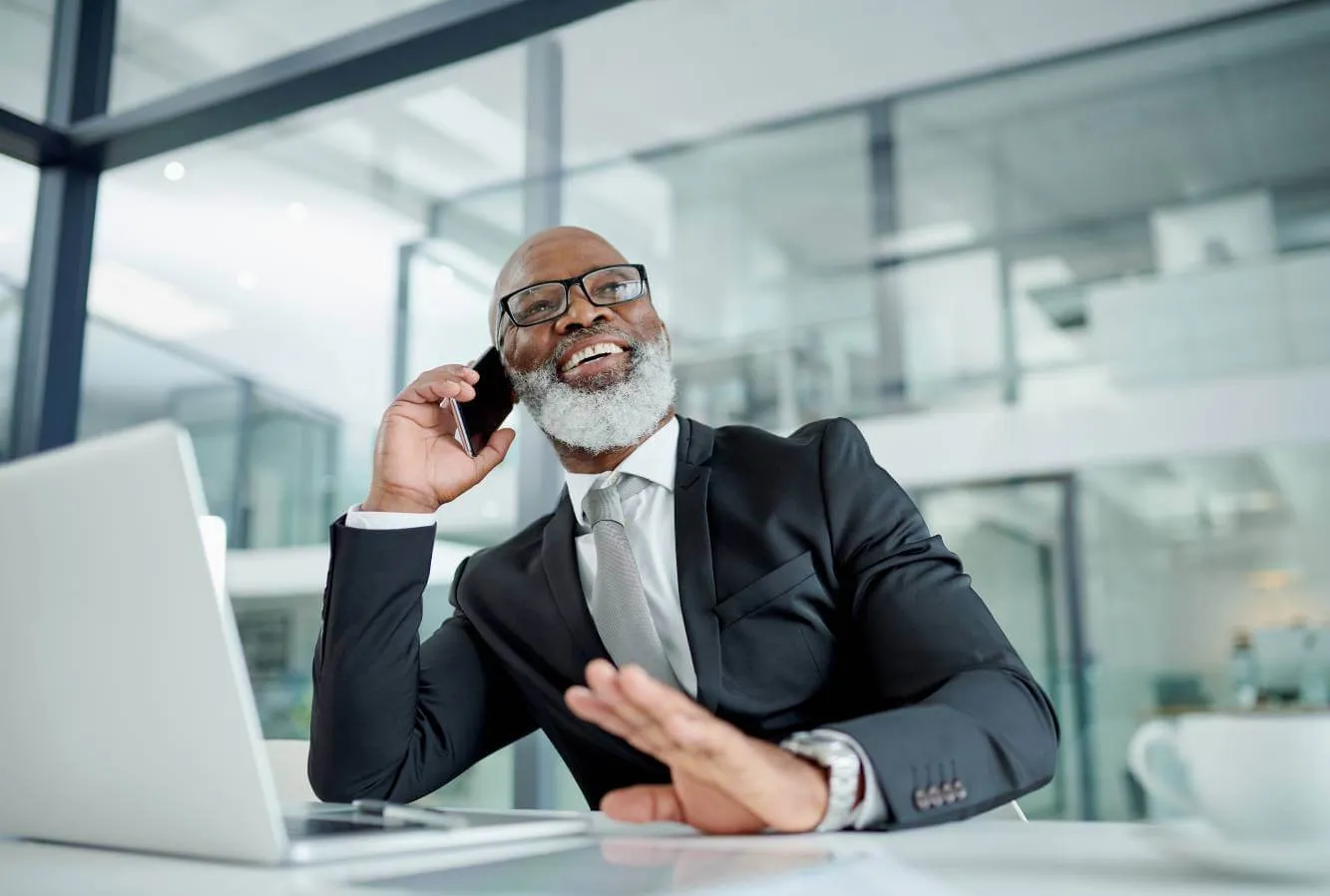 lawyer talking to small business owner on the phone from his office