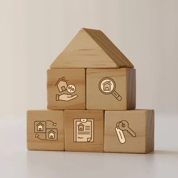 building blogs stacked to look like a house with icons representing home purchase agreement details