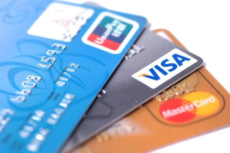 3 credit cards on a white table