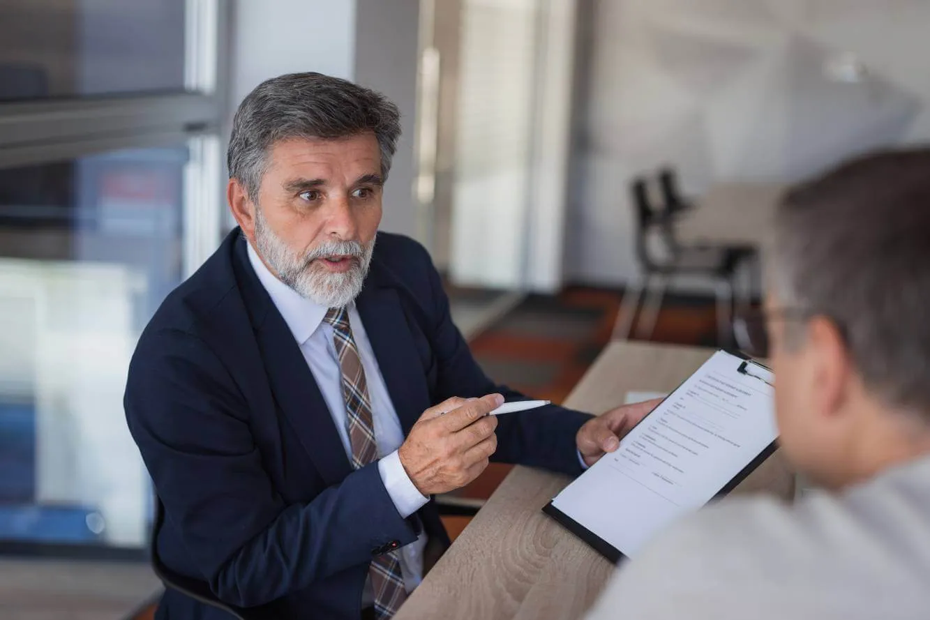 lawyer reviewing independent contractor legal details to small business owner