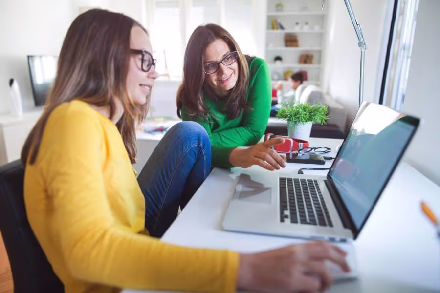 Mother with daughter talking about cyberbullying