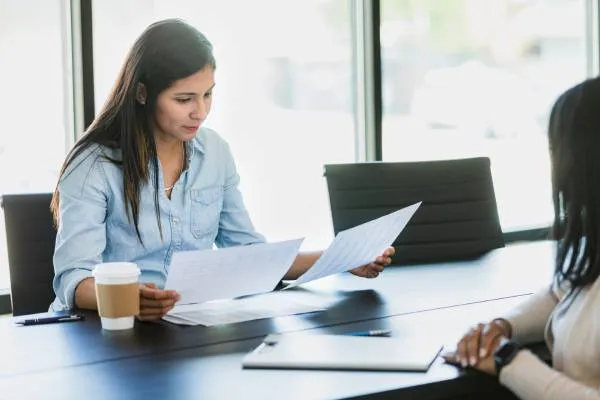 small business owner reviewing business registration documents