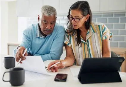 Man and woman deciding what not to include in a Will.