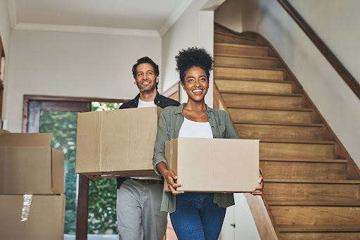 A couple moving in to an apartment, after finding out what a lease agreement is.