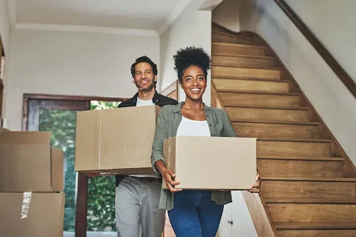 A couple moving in to an apartment, after finding out what a lease agreement is.