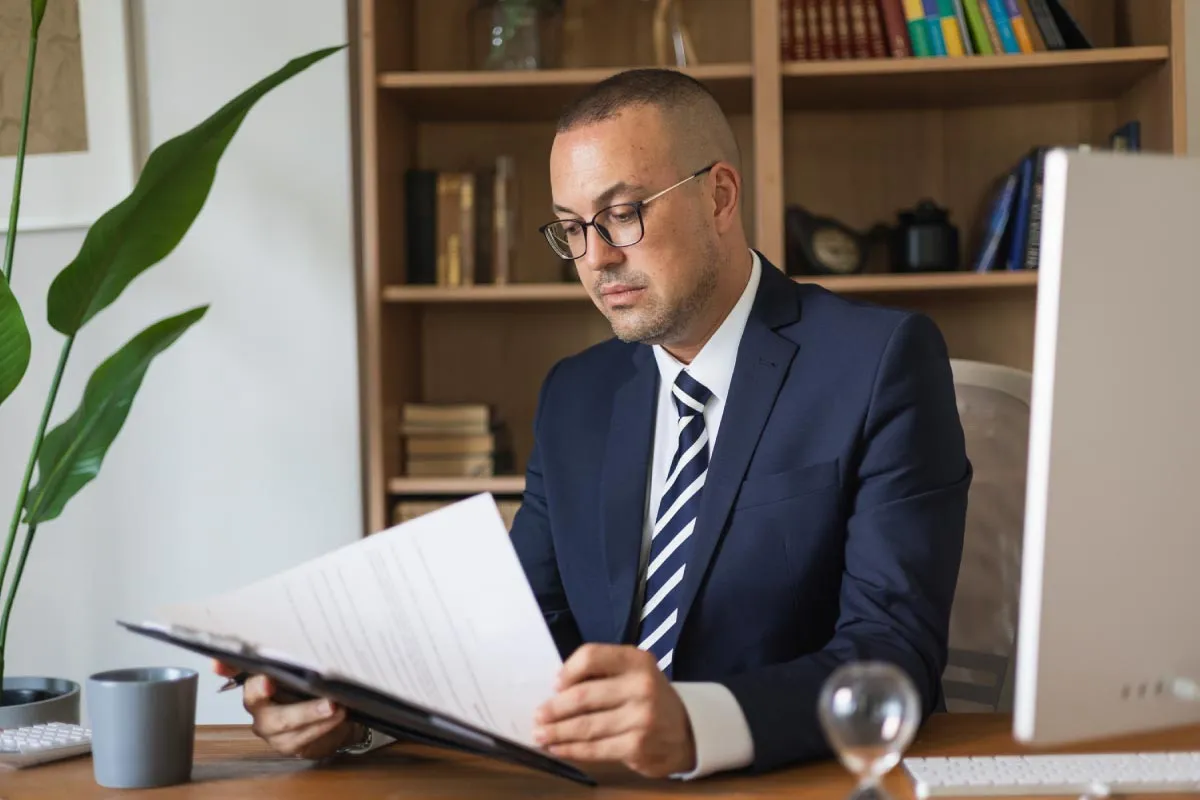 Man working on documents in his office.
