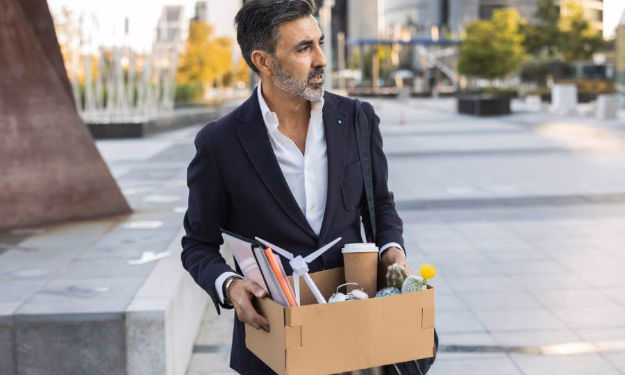 Woman fired from job carrying box of her belongings