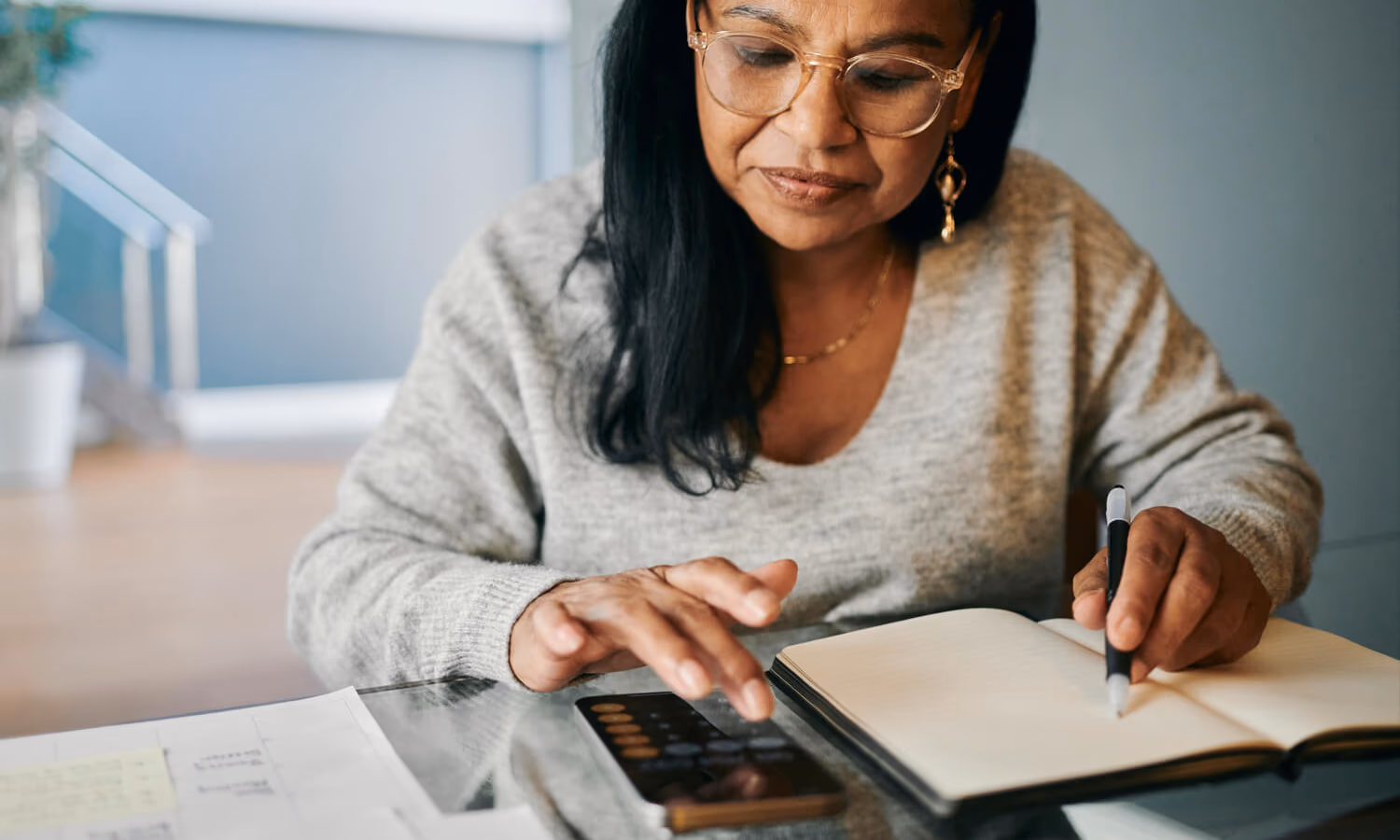 Mature Woman Managing Finances and Budgeting for Pension