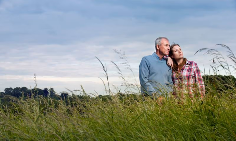 Man and woman standing on family property