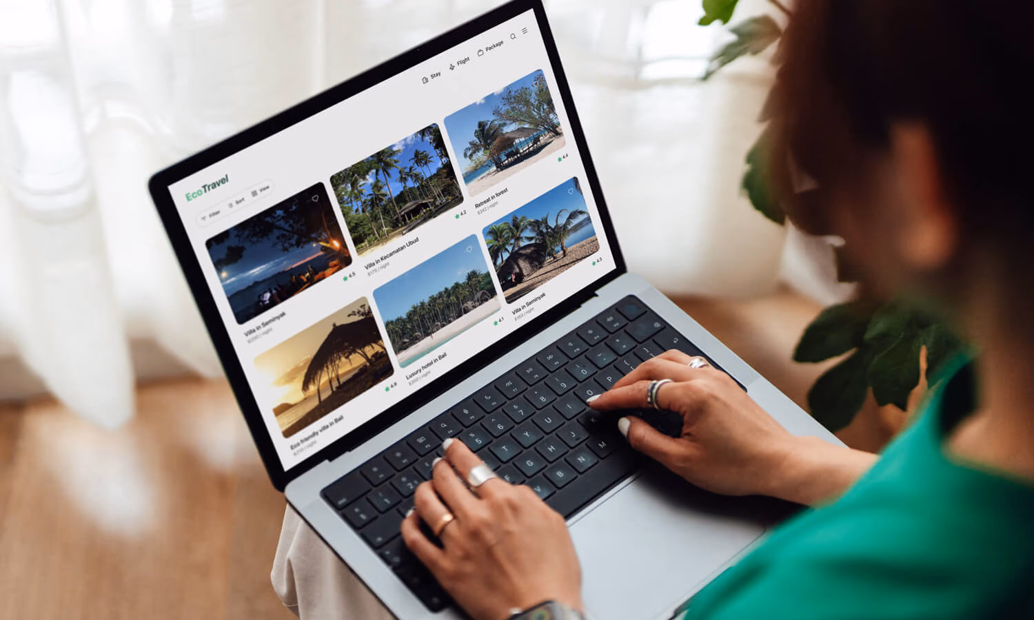 Young woman planning a sustainable travel with laptop