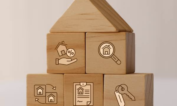 building blogs stacked to look like a house with icons representing home purchase agreement details