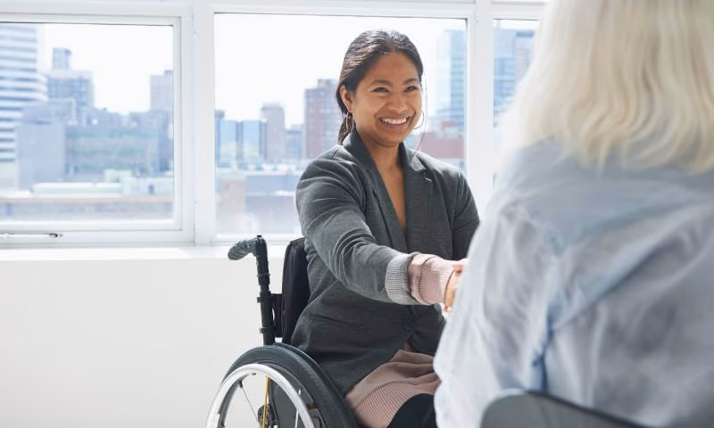 Woman in a wheelchair at a job interview