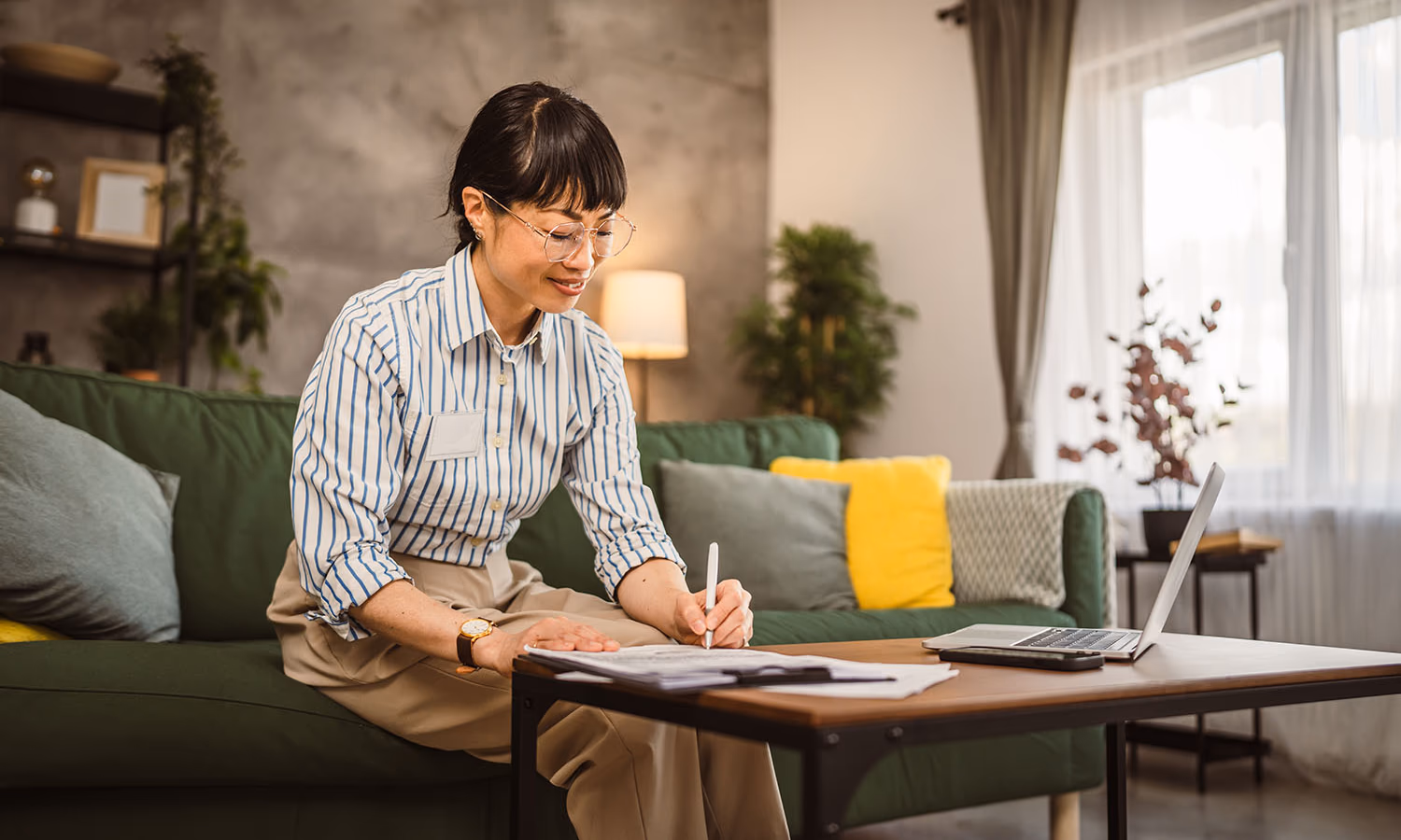 A woman signing a Power of Attorney