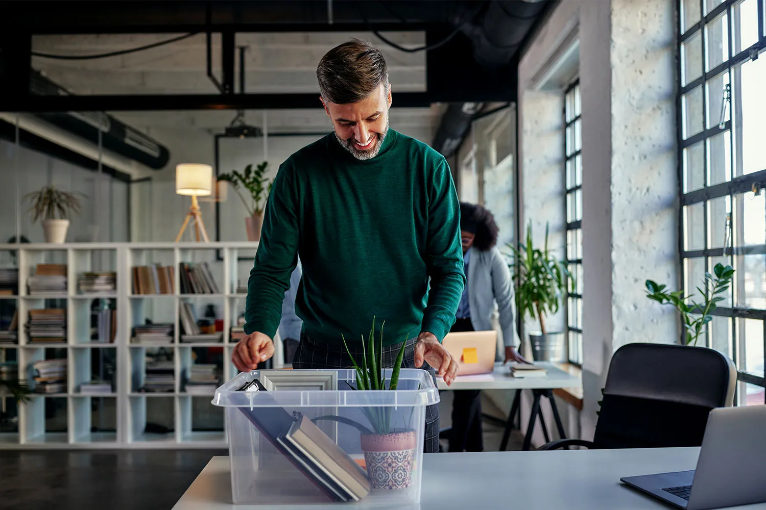 People packing up an office to move.