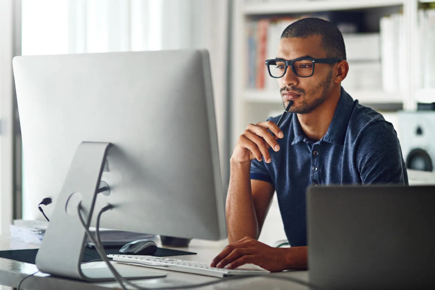 A man filling out business documents.
