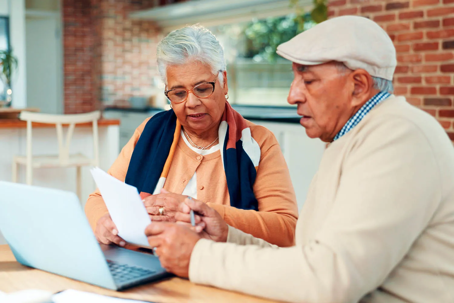 A couple reviewing a document together.