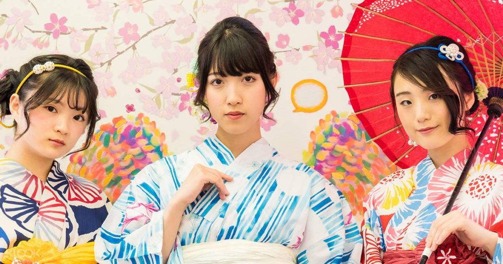 Three young women modeling rental kimono from Wafuku Sakura Kimono.