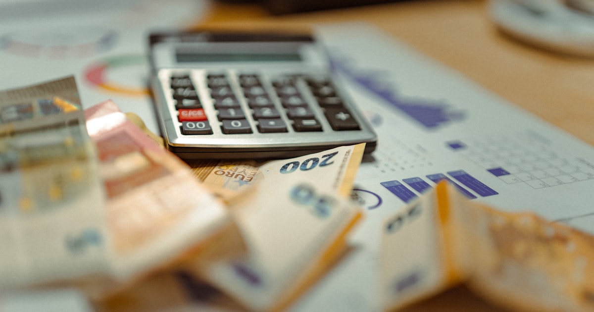 Calculator on pile of money and receipts - gig worker tax deductions
