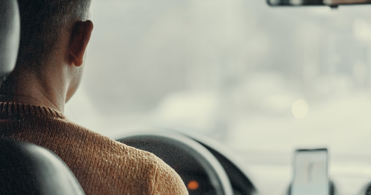 Man driving vehicle - Uber driver taxes guide