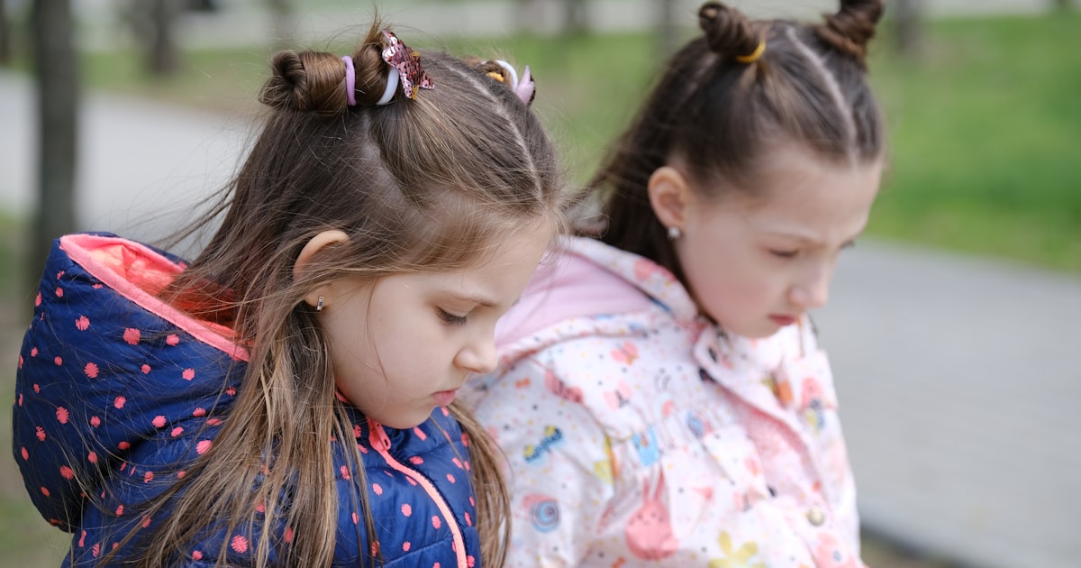 Person using GPS navigation app on smartphone while sitting in driver's seat