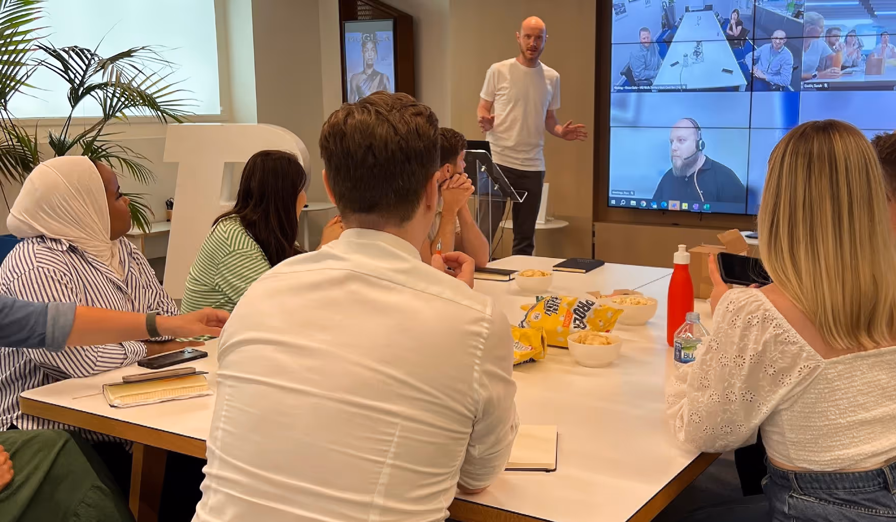 Bauer Media Colleagues attending a presentation in the office