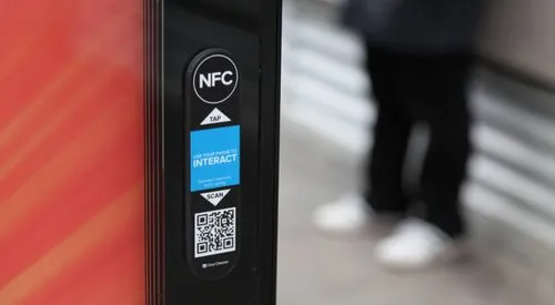 Mobile tag on a bus shelter, including a QR code and NFC