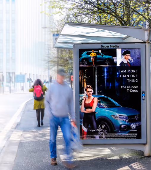A car advert on a bus stop poster