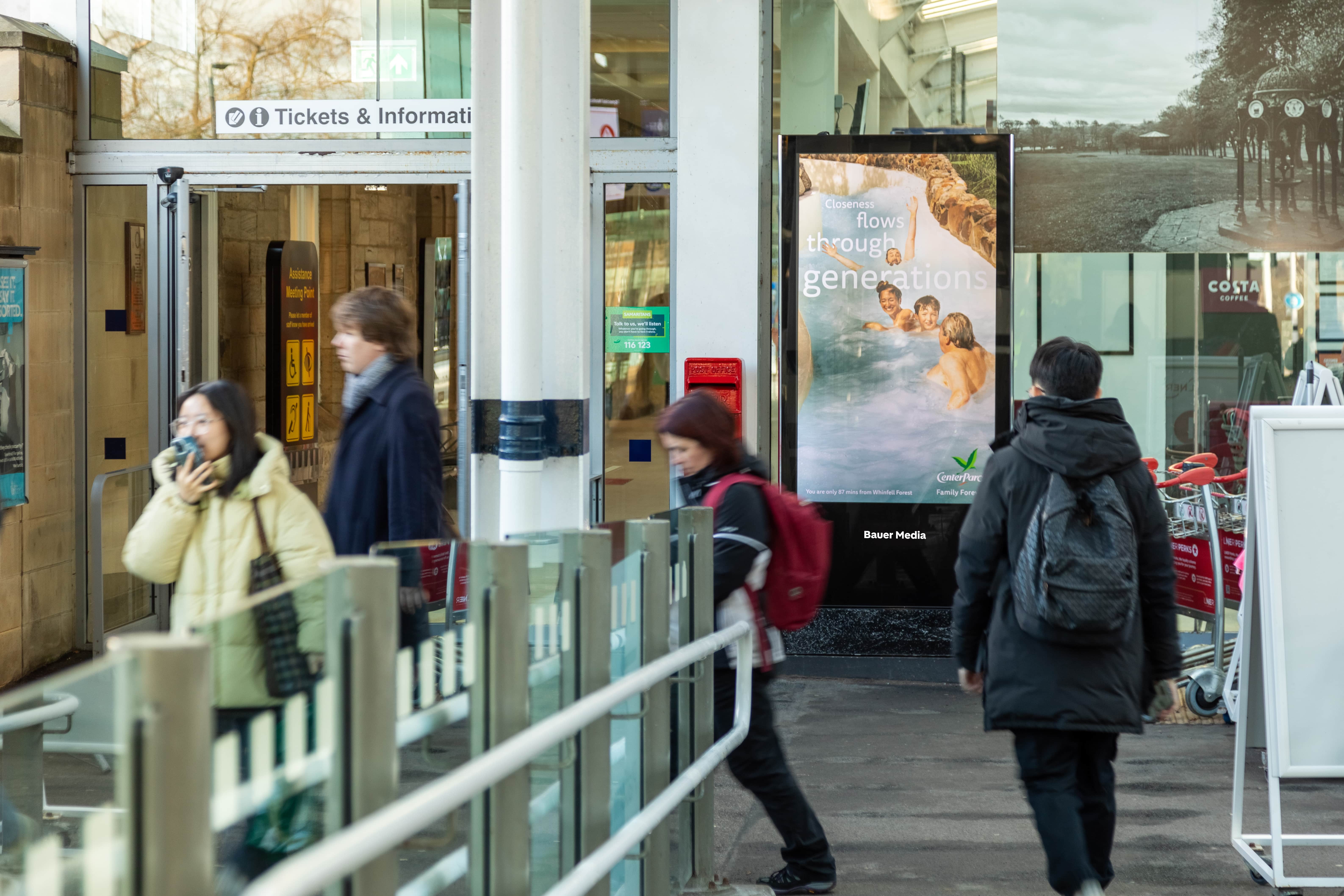 Centreparcs ad with people walking past