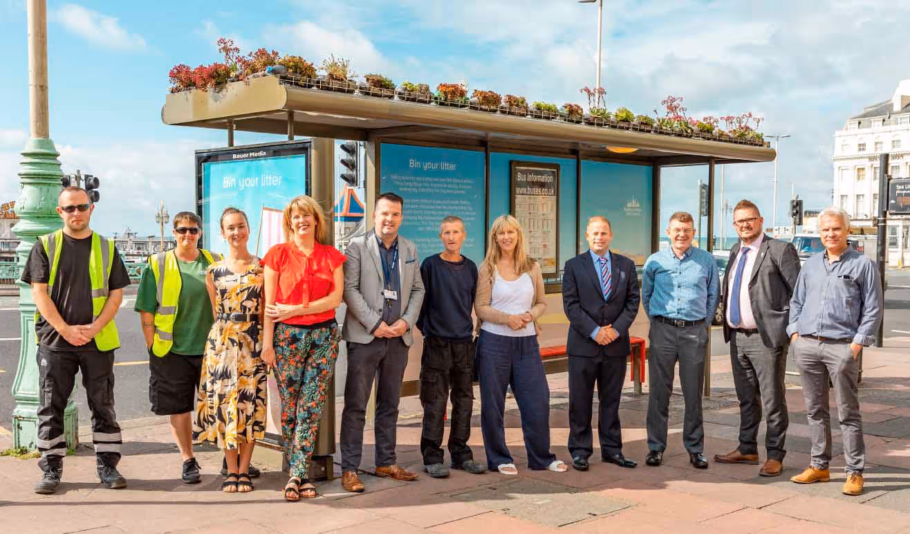 Bauer Media Outdoor and Brighton Council in front on a fully recycled bus shelter