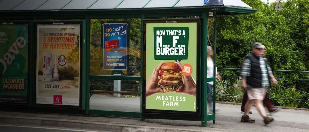 Meatless Farm bus stop poster ad with people walking past