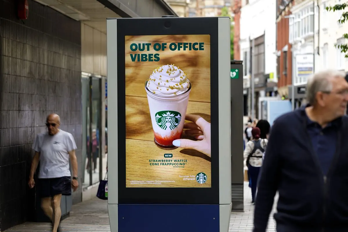 A Starbuck's strawberry waffle cone frappuccino advert on an Adshel Live digital screen