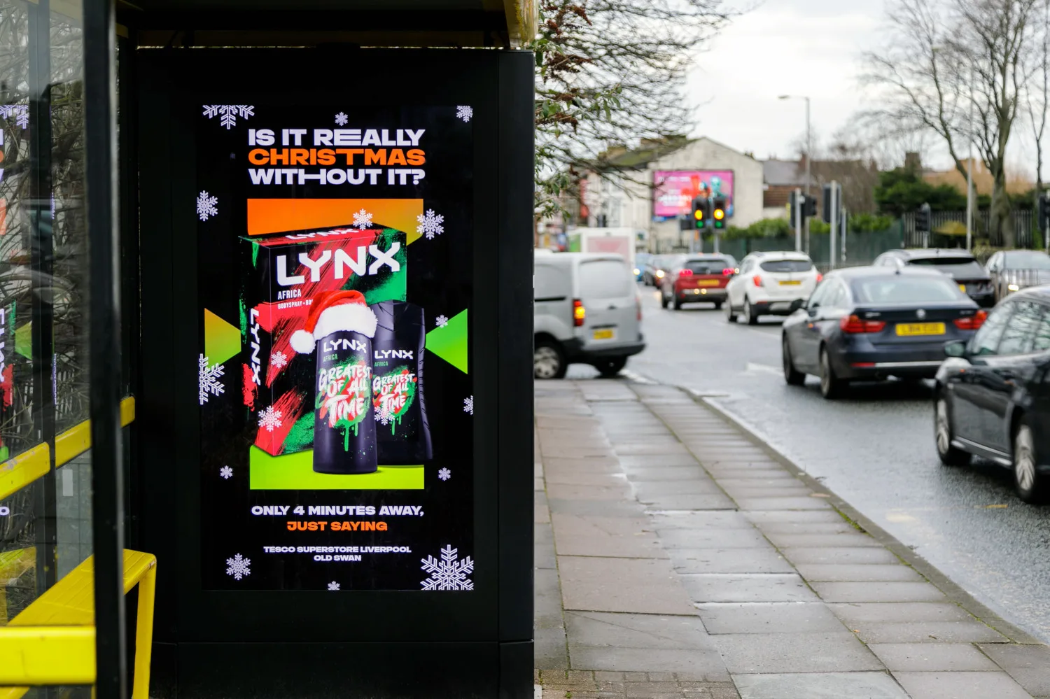 A Christmas Lynx ad campaign on a bus stop screen