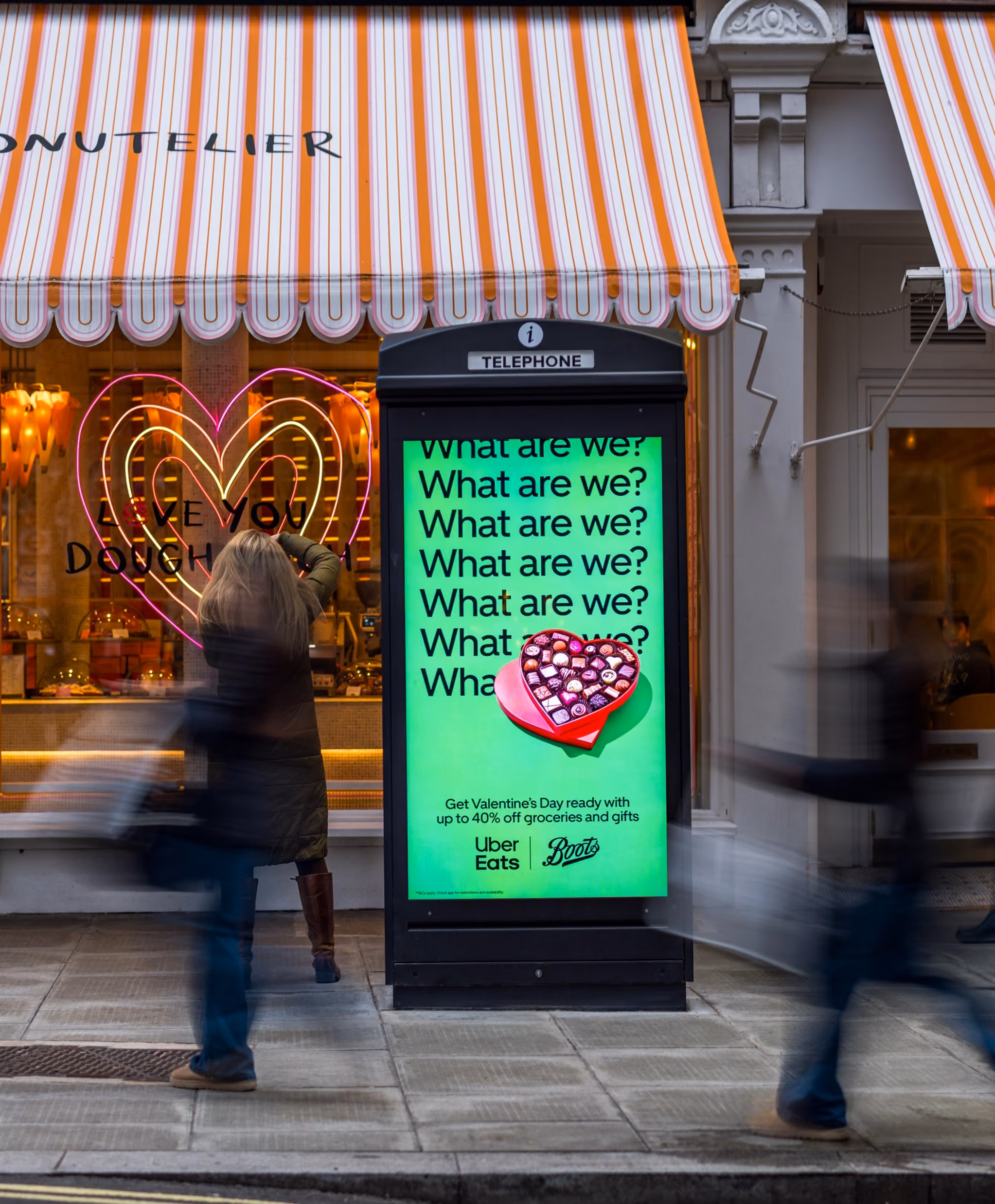 Uber Eats and Boots Valentine’s billboard outside Doughnutelier