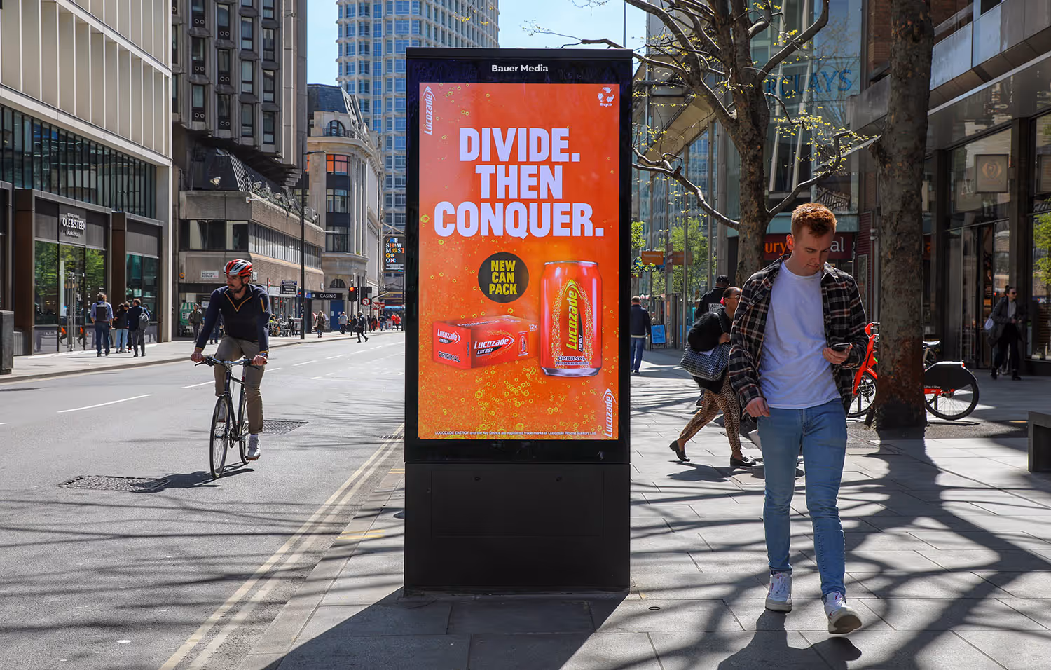 digital 6-sheet panel on a sunny high street