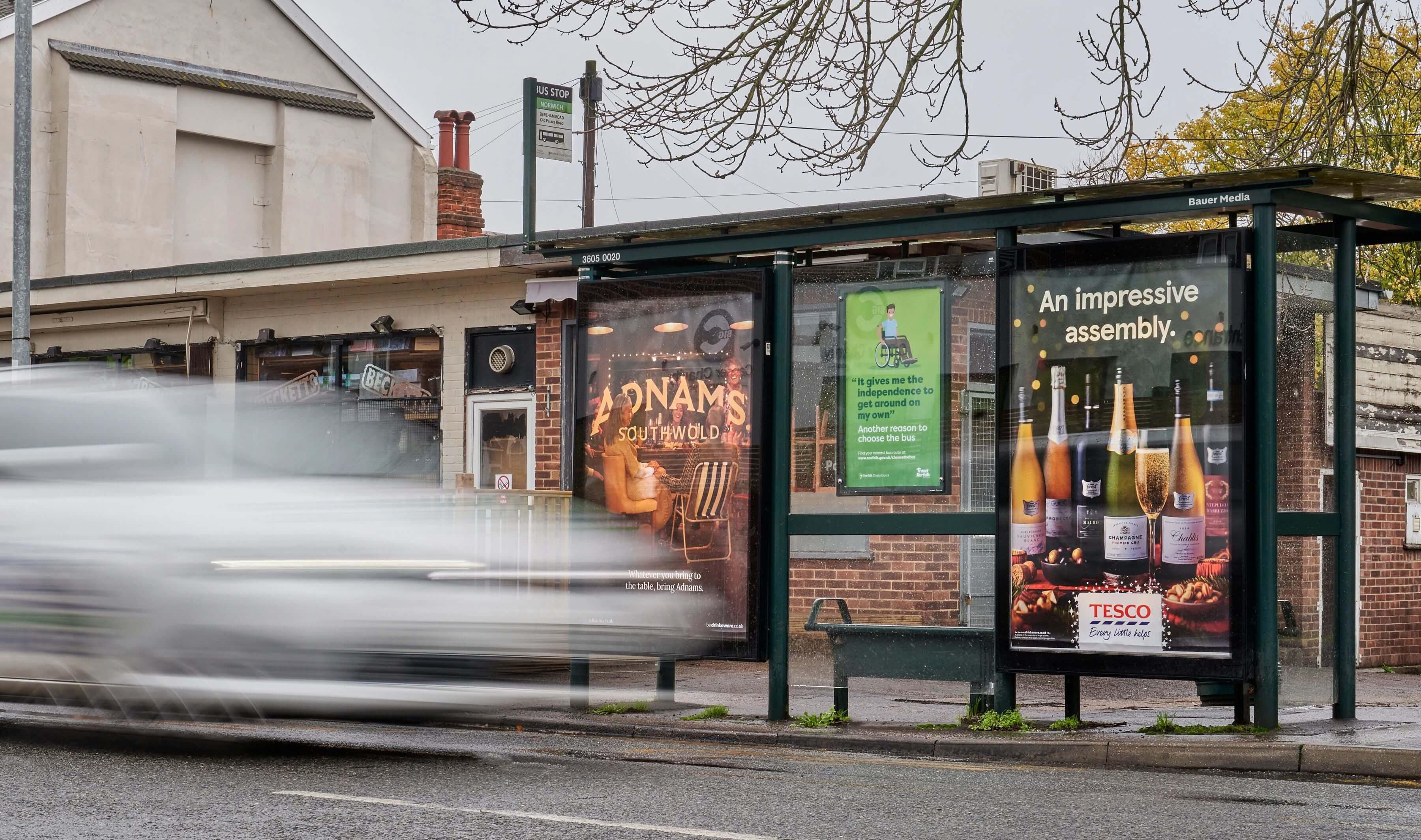 A Tesco ad campaign on a bus stop poster