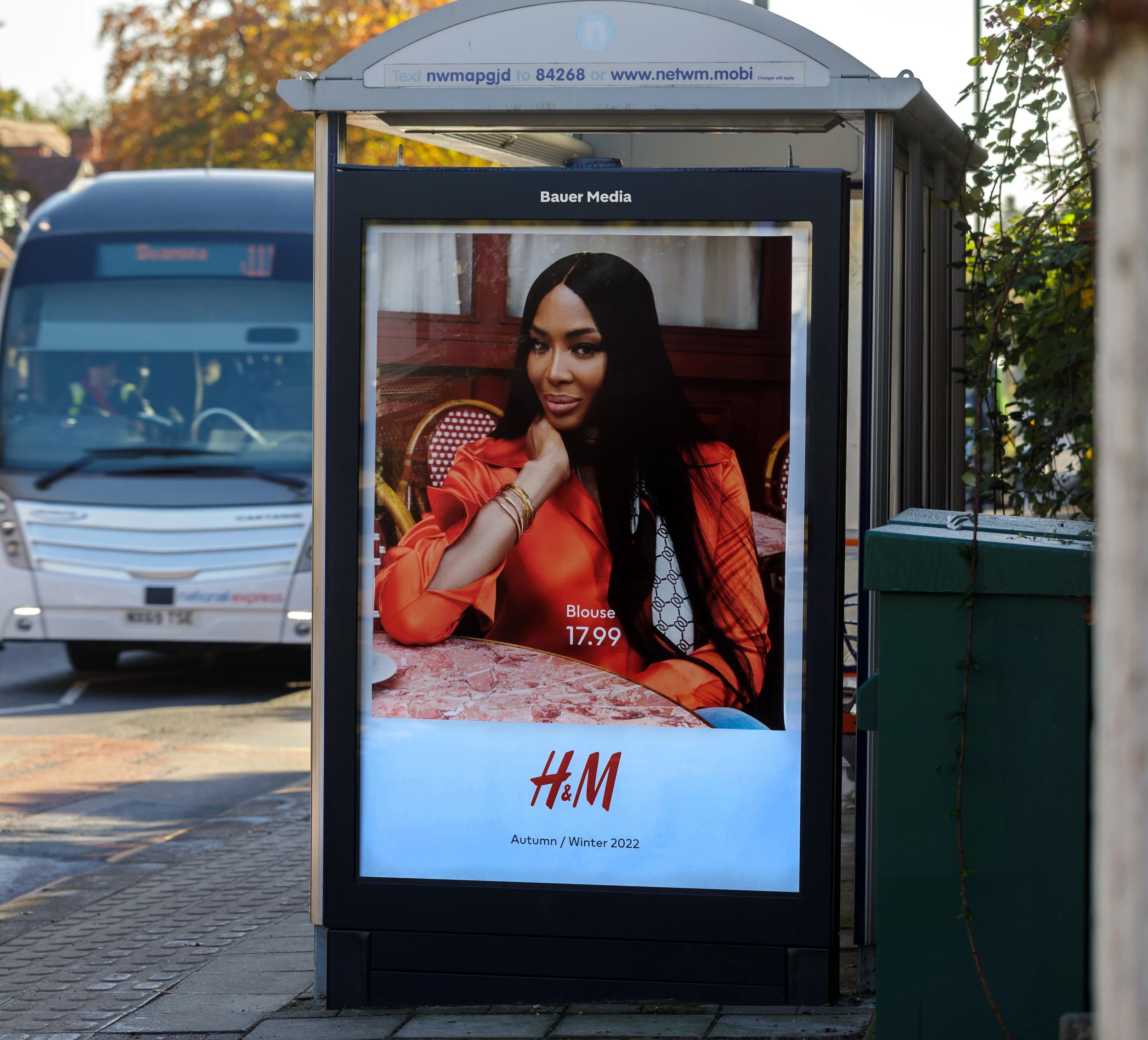 H&M advertising a winter campaign on a bus stop poster