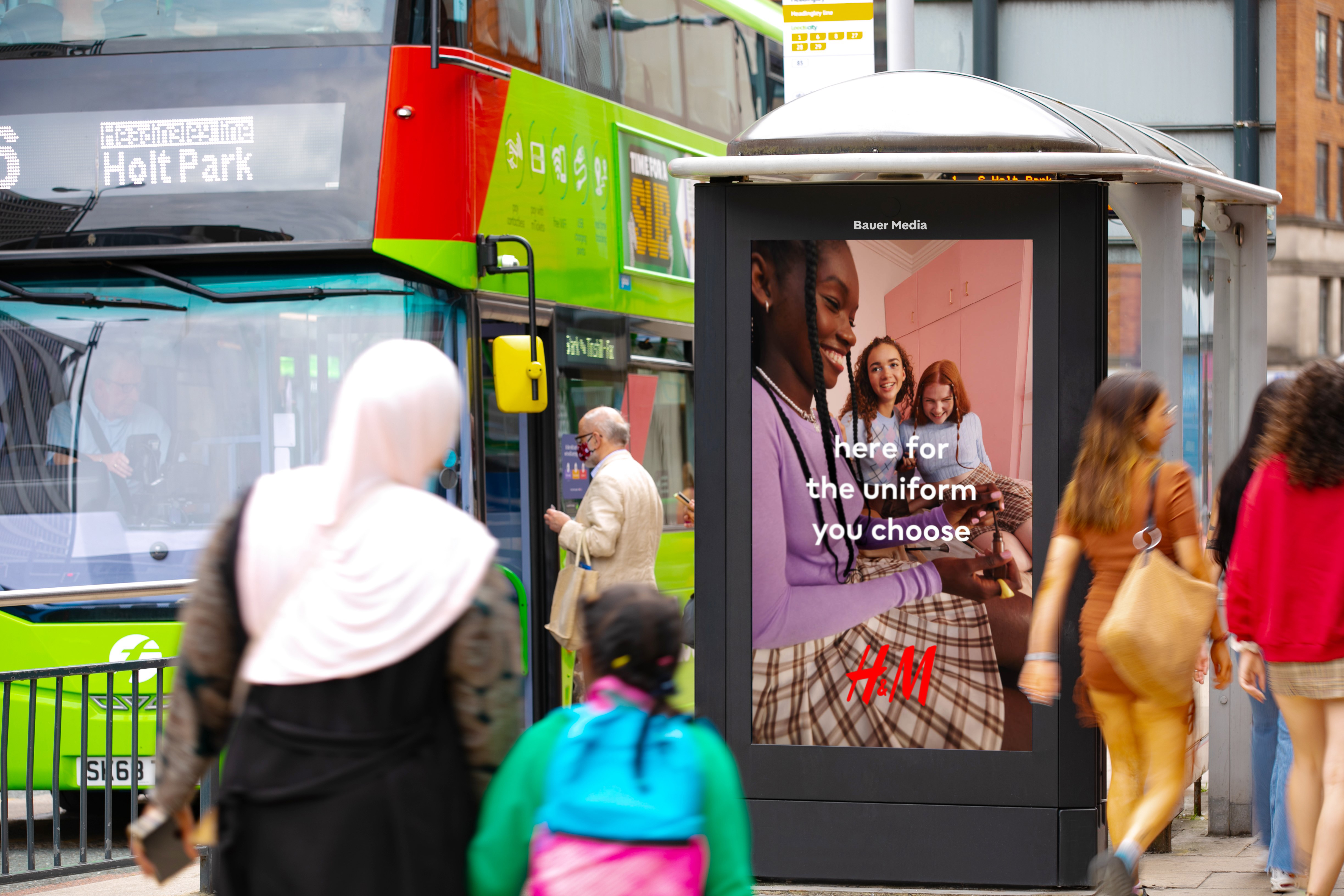 Adshel Live campaign next to a bus
