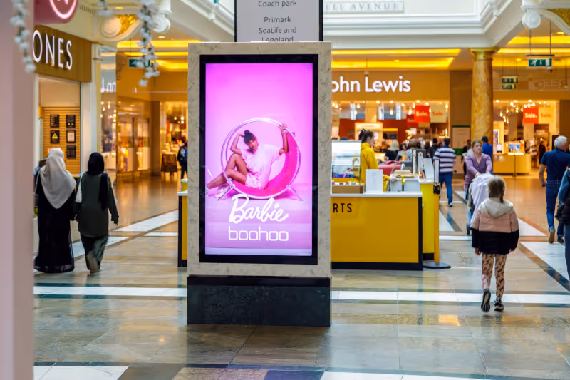Barbie film advertising on a shopping centre screen