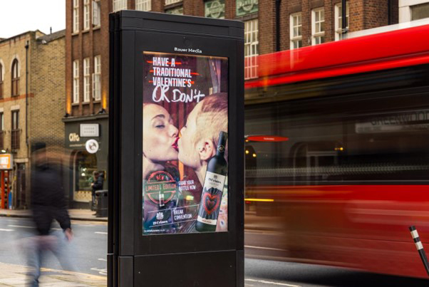 A Valentine's ad campaign displaying on an outdoor digital screen