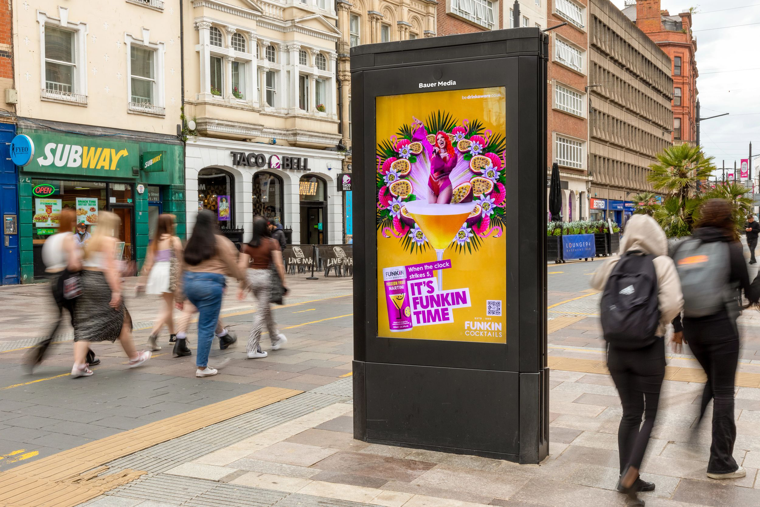 A cocktail advertising campaign displaying on an outdoor digital screen