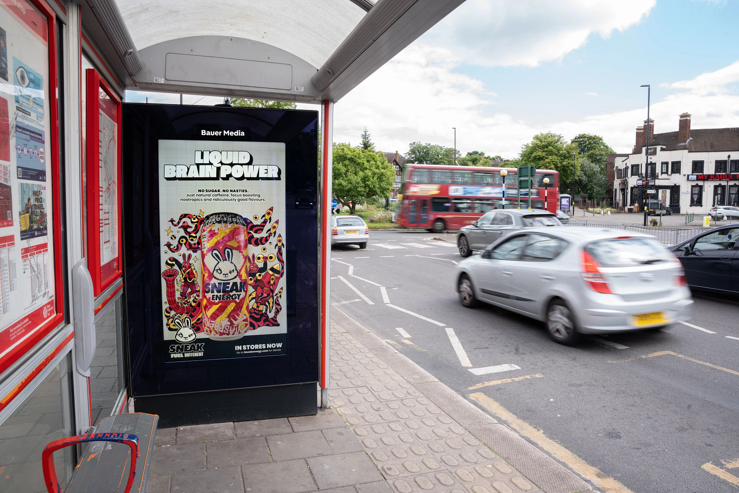 Digital bus stop screen displaying a Sneak Energy campaign