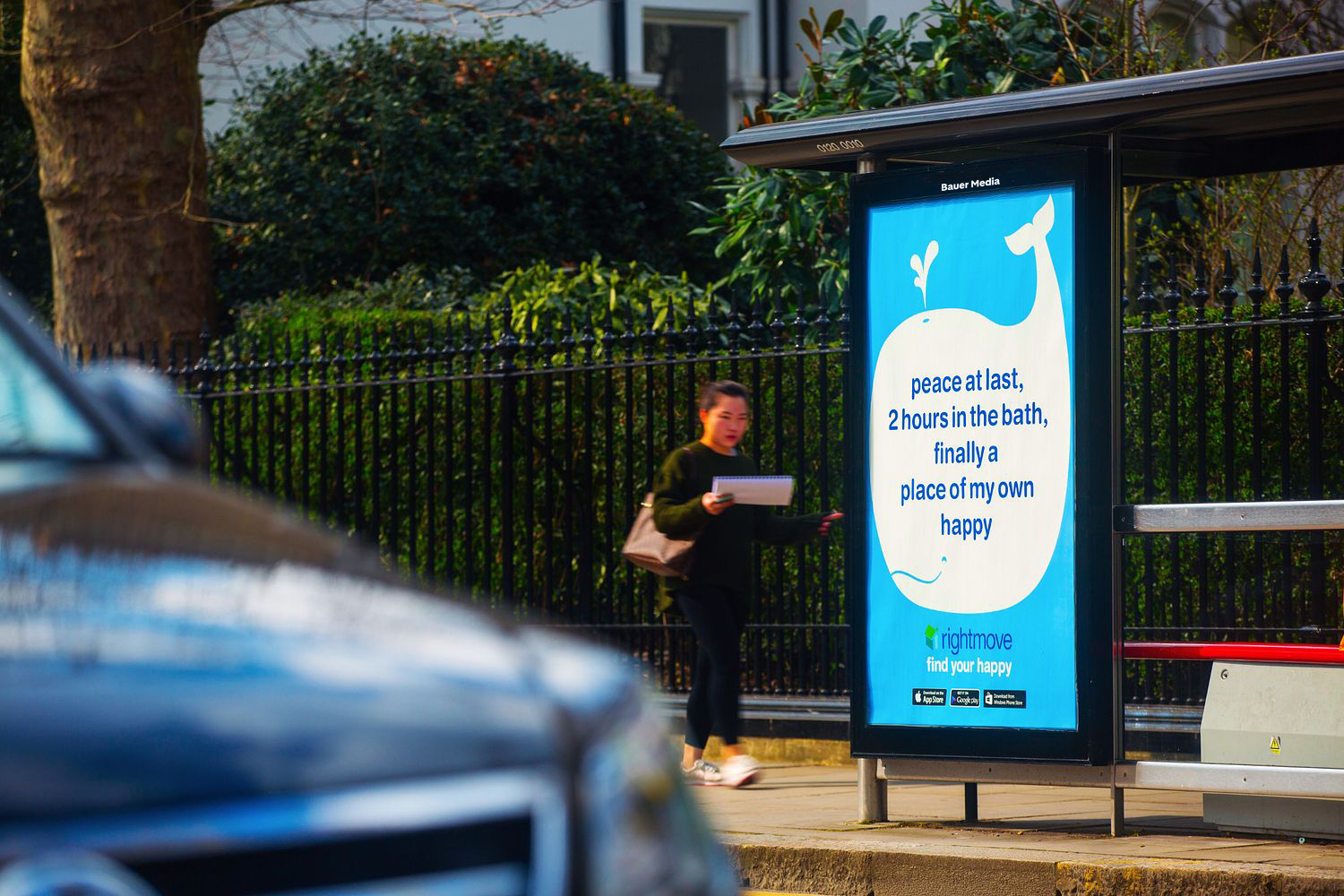 A bus stop poster displaying a Rightmove campaign