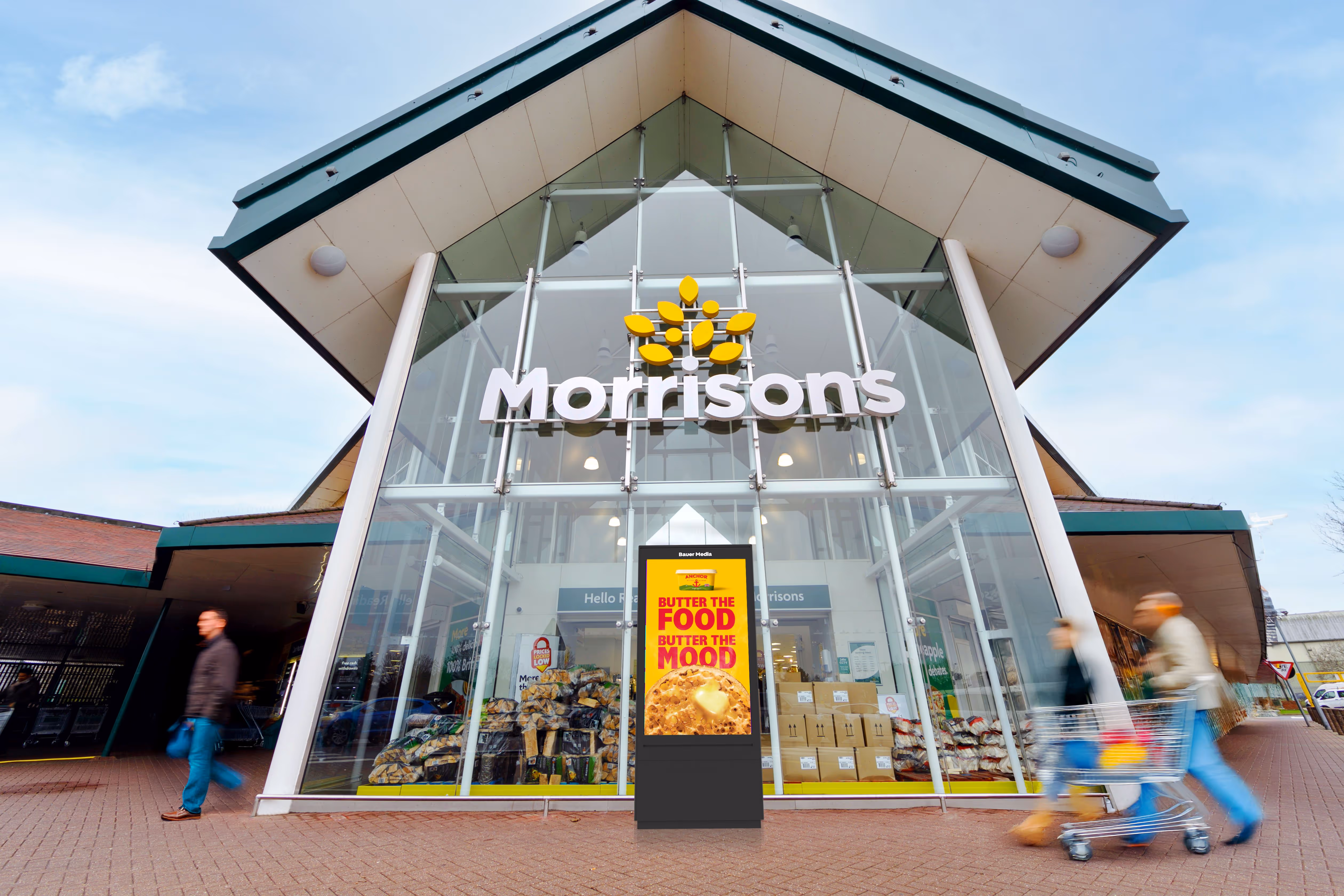 A new digital advertising screen at the entrance of a Morrisons supermarket