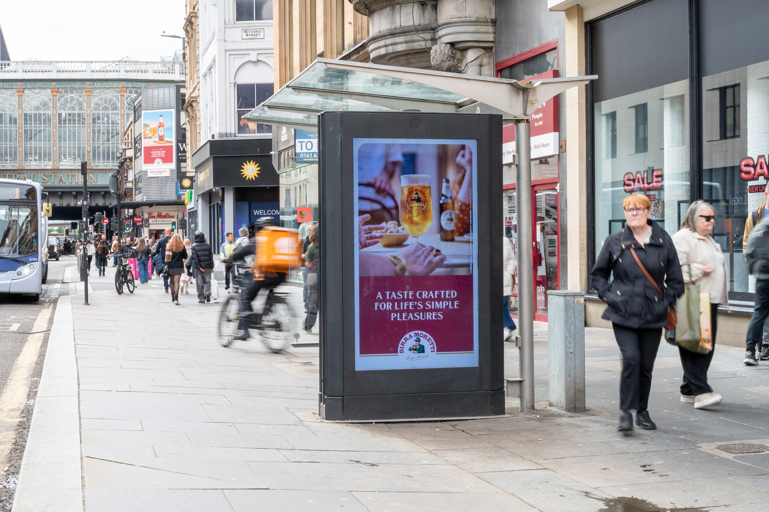 Roadblock activation displaying Birra Moretti campaign across DOOH screens