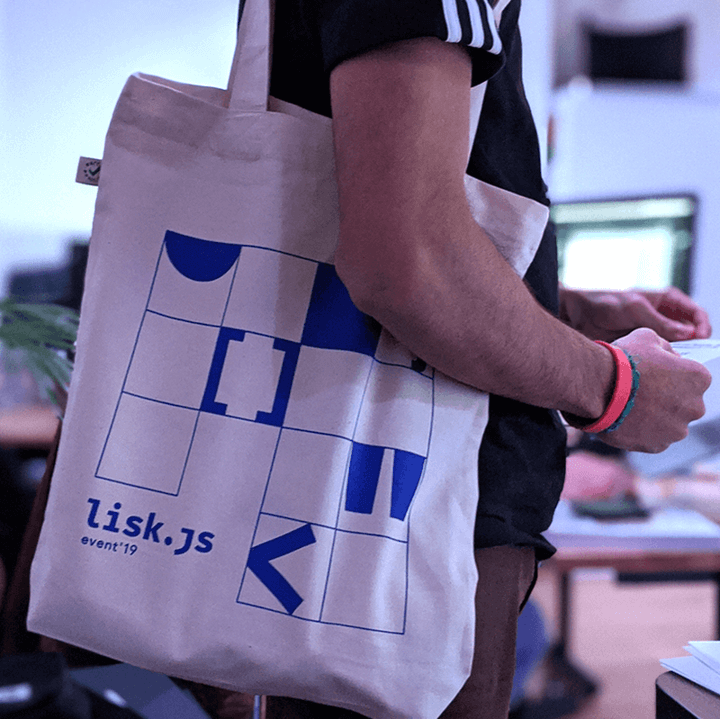 Lisk.js, photo of man with tote bag