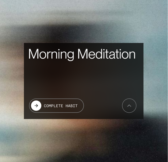 Black translucent box with text 'Morning Meditation' and a button labeled 'Complete Habit' on a blurred background.